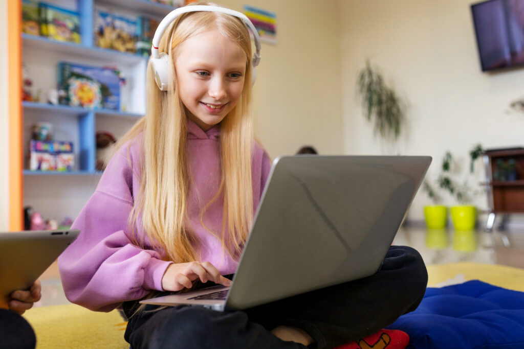 a girl studying online E-Learning on laptop at her home